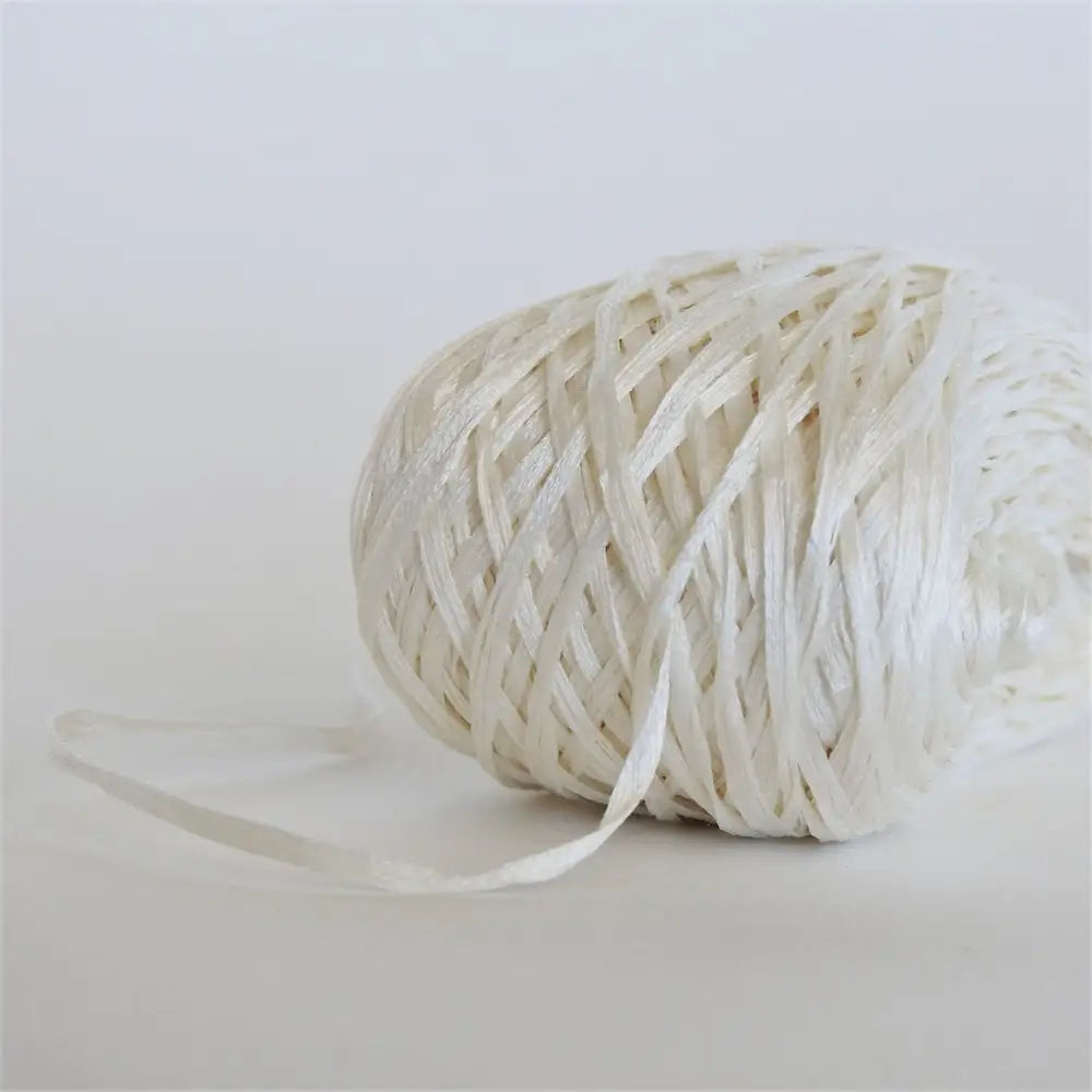 
                  
                    Ball of Habu Silk Tape Yarn in Natural. 100% Japanese silk yarn for knitting, crochet, weaving. Make hats, bags, garments, shawls. Silky and luminous fine tape. Habu Textiles N-6B
                  
                