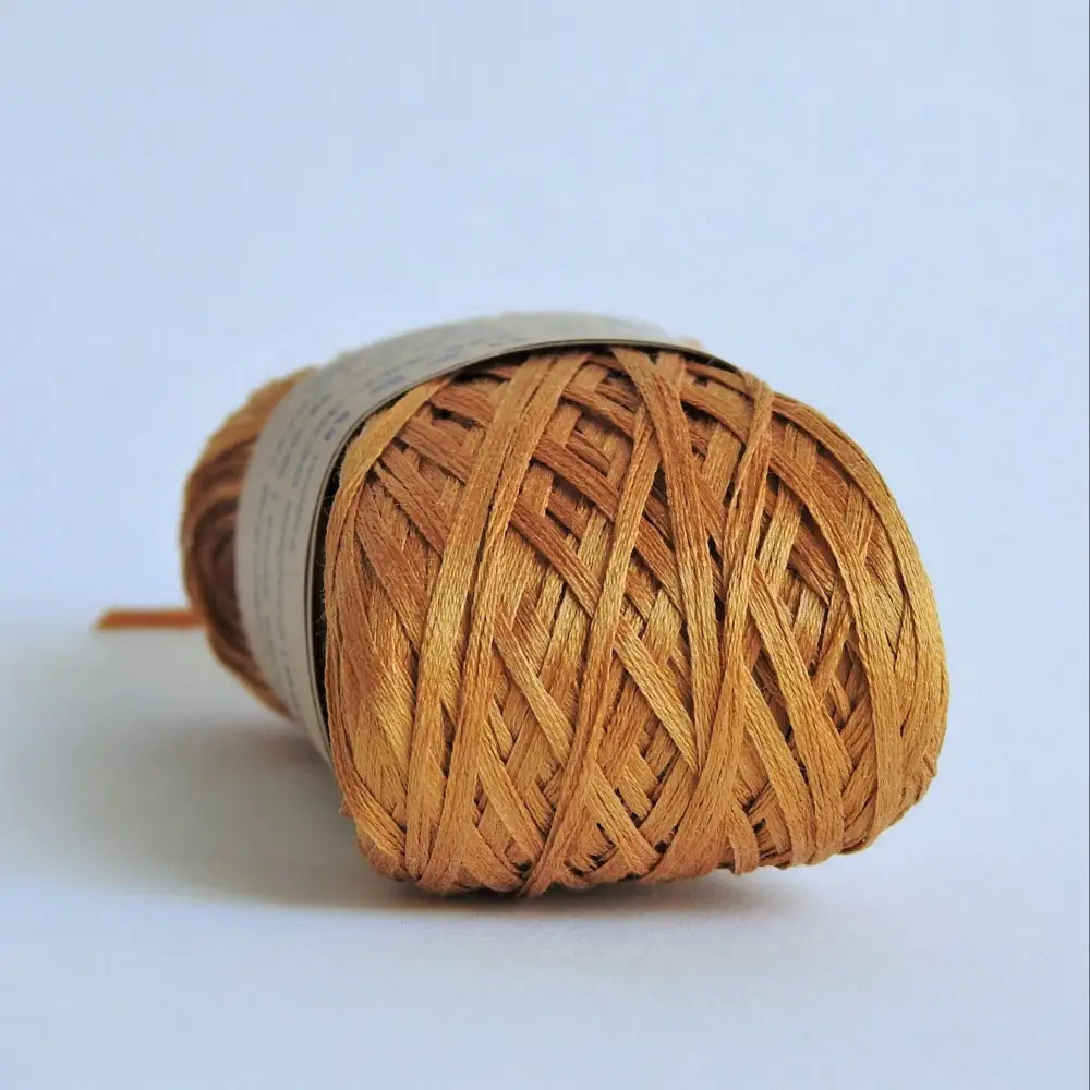 
                  
                    Ball of Habu Silk Tape Yarn in Orange. 100% Japanese silk yarn for knitting, crochet, weaving. Make hats, bags, garments, shawls. Silky and luminous fine tape. Habu Textiles N-6B
                  
                