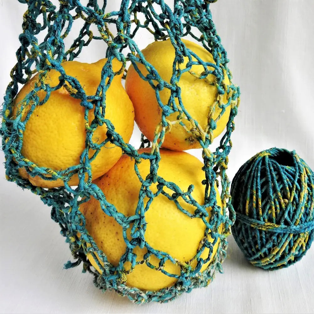 
                  
                    Market string bag crochet using recycled cotton sari twine in Teal; and Yellow. For weaving, jewelry, baskets, piping cord, knitting, crochet. Vegan ecofriendly and handmade yarn. 25m
                  
                