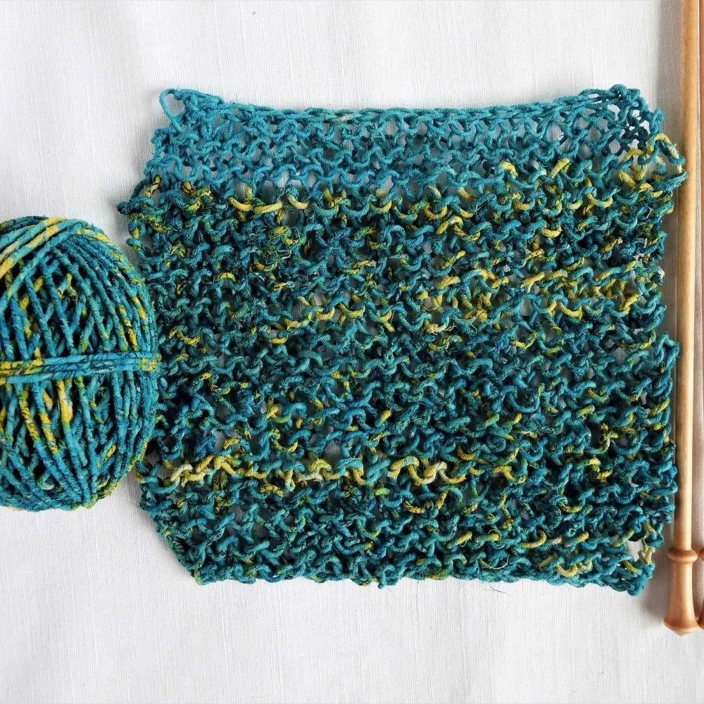
                  
                    Knitted sample using recycled cotton sari twine in Teal and Yellow. For weaving, jewelry, baskets, piping cord, knitting, crochet. Vegan ecofriendly and handmade yarn. 25m
                  
                