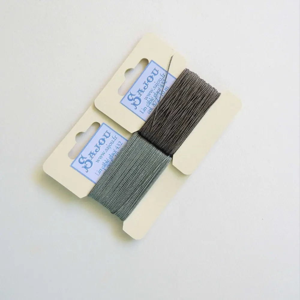 
                  
                    Cards of waxed linen thread in Mouse and Slate.  Wax linen thread for beading, jewellery, leather sewing, book binding, bracelets. Heavy duty thread. Size 432. Fil au Chinois waxed Linen from Maison Sajou. 
                  
                