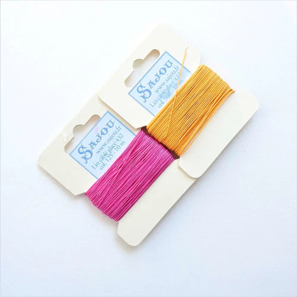 
                  
                    Cards of waxed linen thread in Peony and Yellow.  Wax linen thread for beading, jewellery, leather sewing, book binding, bracelets. Heavy duty thread. Size 432. Fil au Chinois waxed Linen from Maison Sajou. 
                  
                