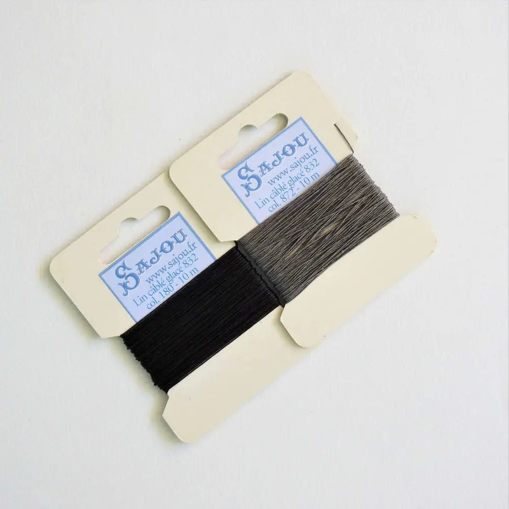 
                  
                    Cards of waxed linen thread in Black and Slate.  Wax linen thread for beading, jewellery, leather sewing, book binding, bracelets. Heavy duty thread. Size 832. Fil au Chinois waxed Linen from Maison Sajou. 
                  
                
